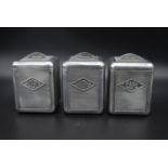 A set of three mid century French aluminium, cafe, sucre and chicoree canisters. H.16 W.12cm