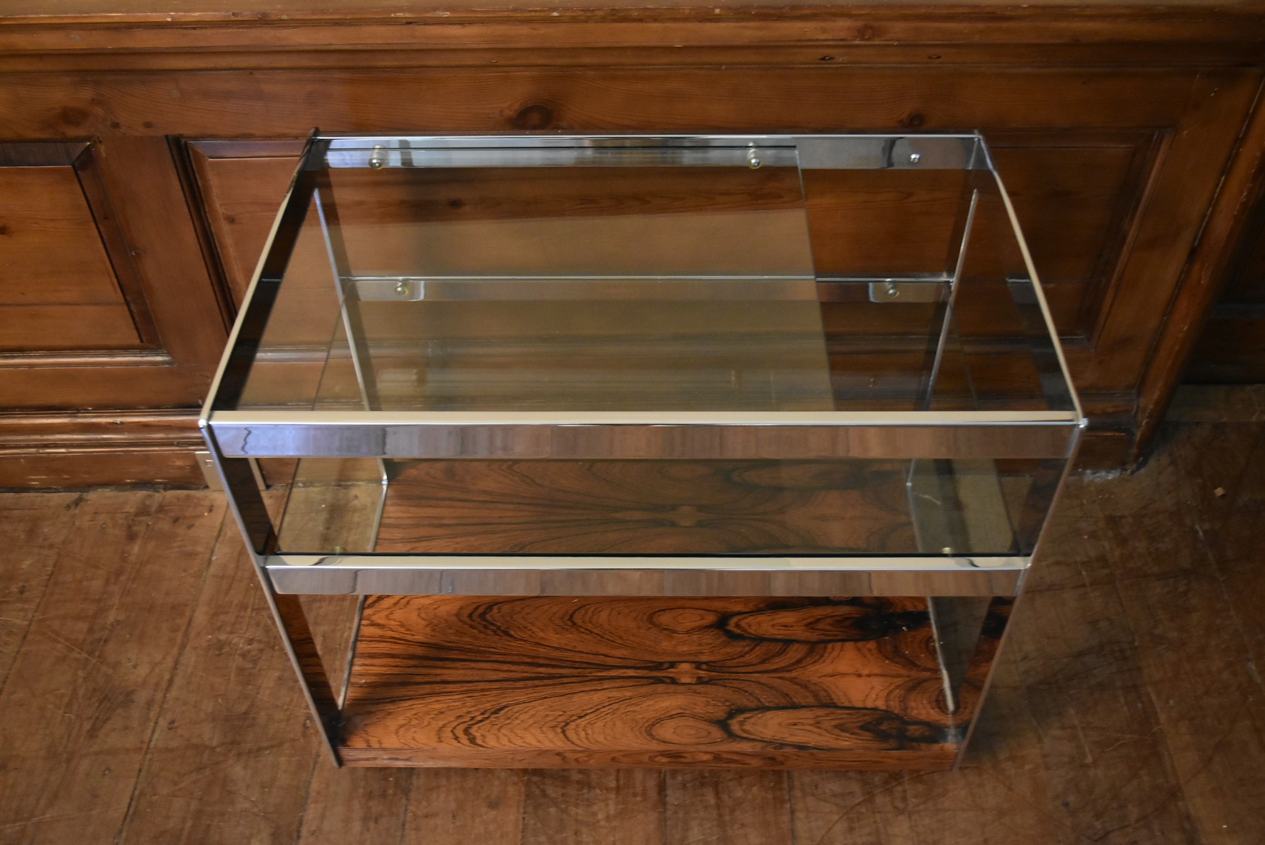 A Merrow Associates chrome framed drinks trolley with plate glass tiers on casters. H.64 W.73 D.46cm - Image 2 of 6