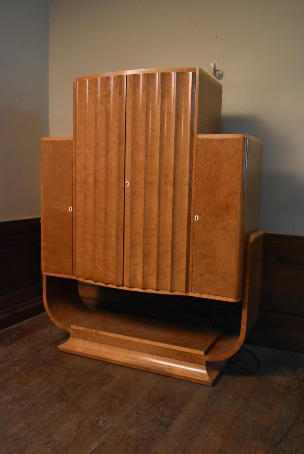 An Art Deco burr walnut cocktail cabinet with ribbed central panel doors enclosing glazed and lit - Image 3 of 23