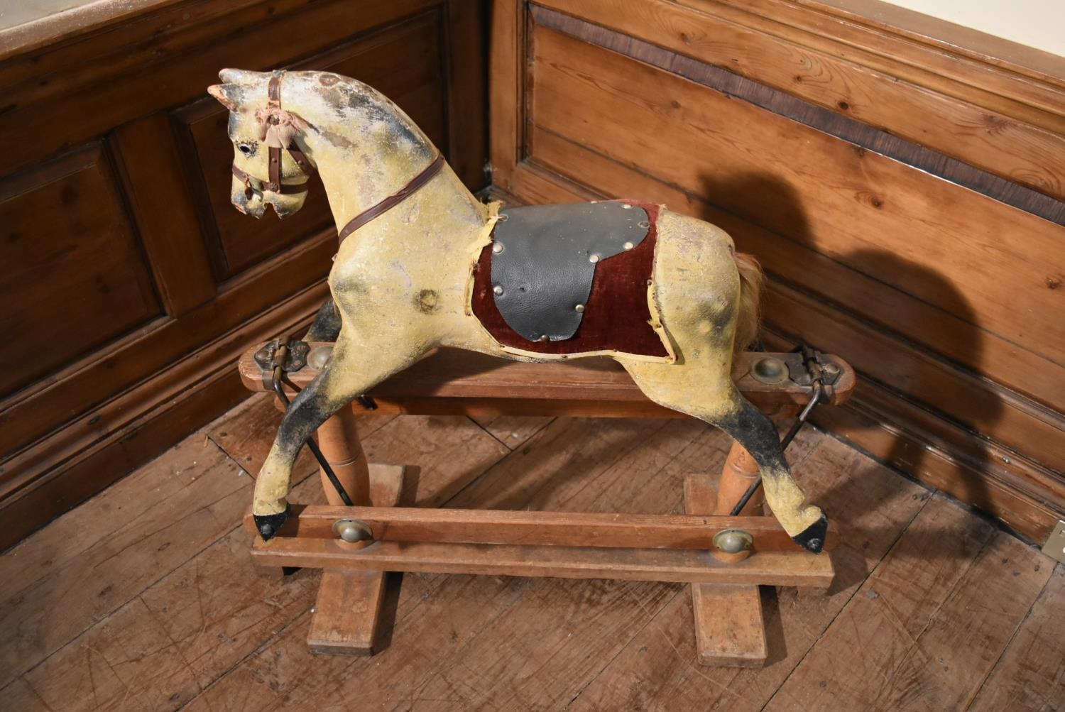 An early 20th century carved and painted Triang rocking horse on swing action oak platform base. H. - Image 2 of 10