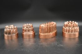 A collection of four Victorian copper jelly moulds. One stamped Hodges & Sons, Dublin. H.14 Dia.13.