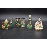 A collection of Chinese ceramic figures. Including a porcelain Royal Worcester emperor figure, and