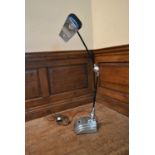 An Art Deco chrome anglepoise desk lamp on stepped base marked: Flexo. H.100 W.46 D.23cm