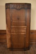 A vintage oak Jacobean style hall cupboard. H.183 W.95 D.35cm