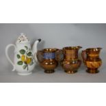 Three antique copper lustre ware pitchers along with a Port Merion Pomona design coffee pot with