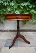 A Chinese hardwood small drum table fitted with frieze drawer. H.65cm Dia.56cm