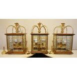 A set of three contemporary brass and oak framed ceiling lanterns in the 19th century style each