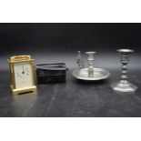 A brass Taylor and Bligh carriage clock with quartz movement, a pair of cased opera glasses, a