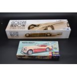 A boxed Schylling Golden Arrow racing car along with a Revell Austin Healey model kit. H.10 W.54 D.