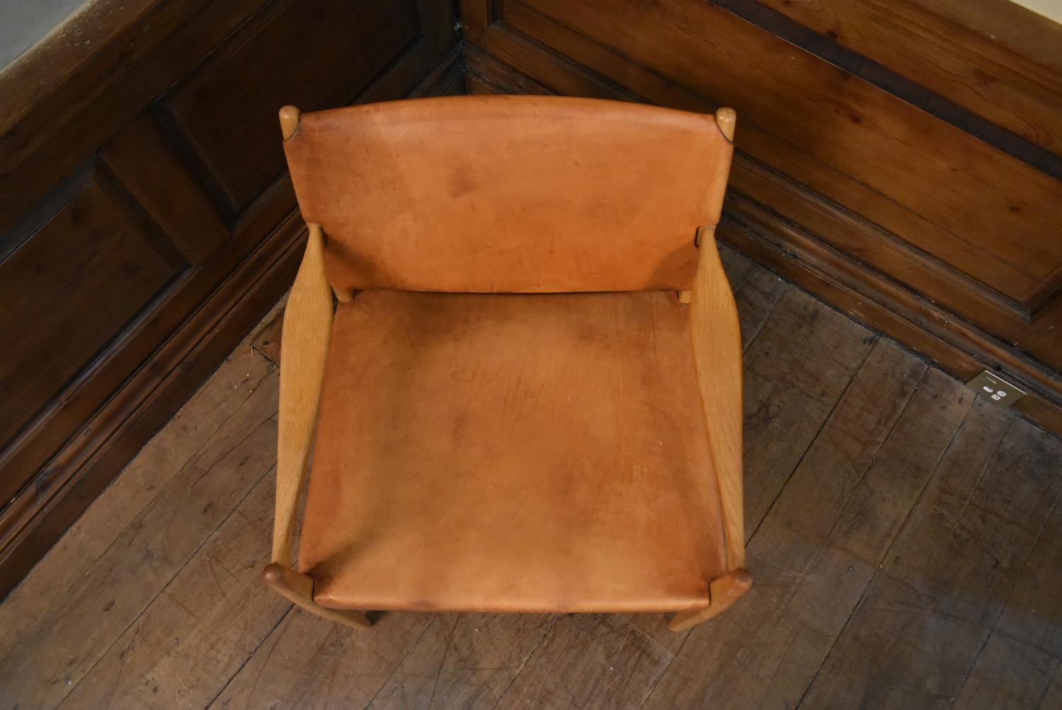 A mid century Scandinavian oak framed armchair with stretched light tan leather seat and back. H. - Image 4 of 6