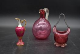 A cranberry glass jug, a posy bowl and a Limoges ewer. H.19cm (3) (jug chipped as photographed).