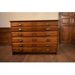 A C.1900 oak two section six drawer plan chest with brass cup handles. H.85 W.120 D.85cm