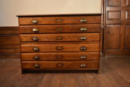 A C.1900 oak two section six drawer plan chest with brass cup handles. H.85 W.120 D.85cm