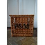 A contemporary wicker hamper basket marked F & M. H.38 W.39 D.39cm