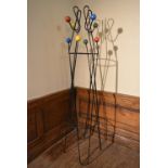 A mid century retro vintage metal floor standing coat stand with multi coloured atomic style coat