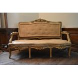 A 19th century French three seater canape with carved gilt and painted framed raised on cabriole