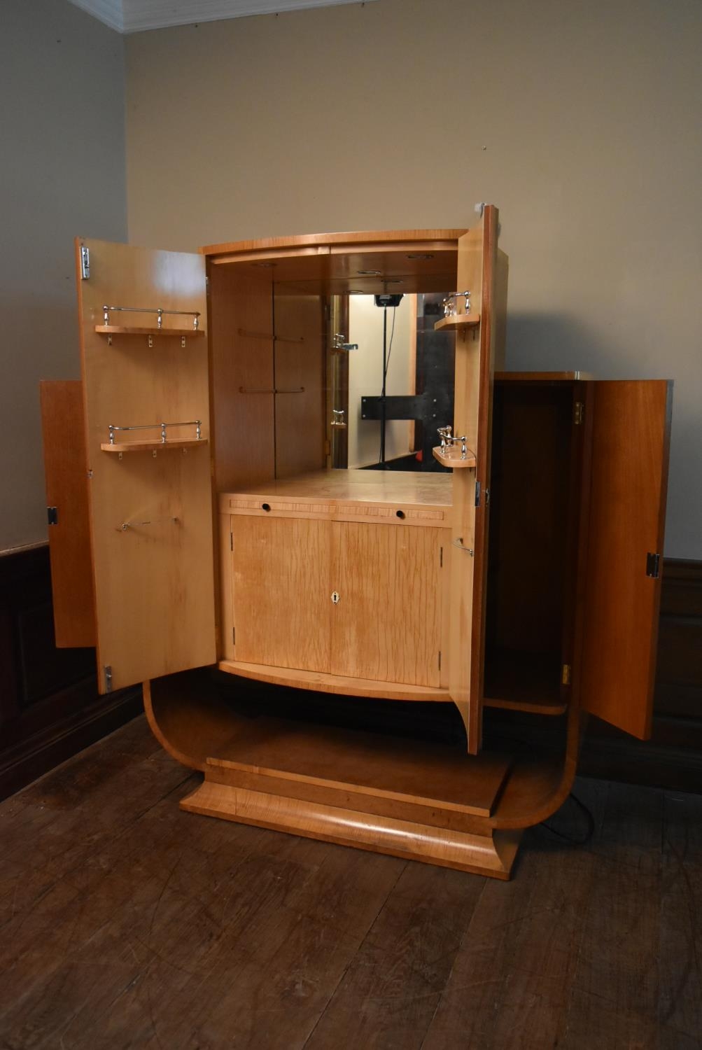 An Art Deco burr walnut cocktail cabinet with ribbed central panel doors enclosing glazed and lit - Image 7 of 23