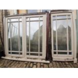 A painted hardwood window frame of eighteen double glazed panels and a similar single nine panel