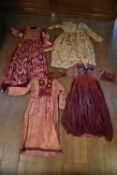 Four Asian antique patch work silk and cotton traditional dresses. Some with applied embroidery