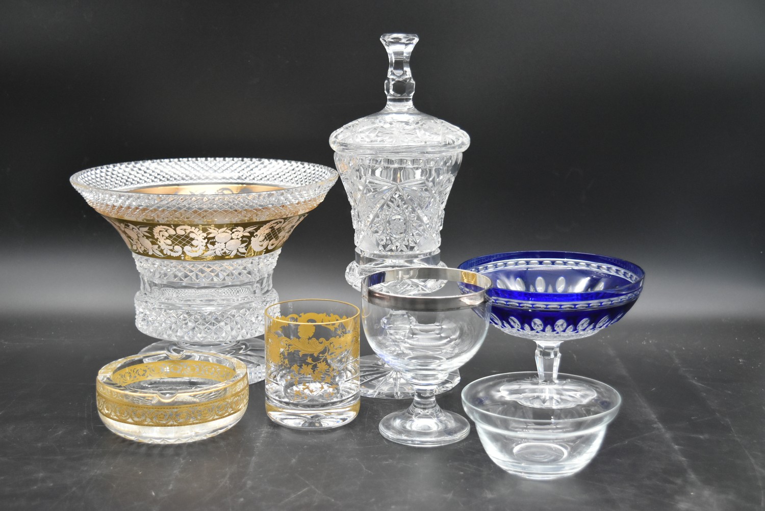 A collection of cut glass and crystal. Including a Bohemian blue cut to clear pedestal bowl, a