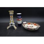 A French faience candlestick, a Mason's Imari style bowl and a 19th century floral decorated vase.