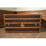 A C.1900 Louis Vuitton canvas monogrammed travelling wardrobe cabin trunk with original maker's