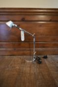 An Artemide Tolemino desk lamp, boxed and with original tag. H.50 Dia.10cm (base)