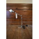 An Artemide Tolemino desk lamp, boxed and with original tag. H.50 Dia.10cm (base)