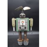 A metal robot sculpture made from vintage electrical components. H.49 W.26cm