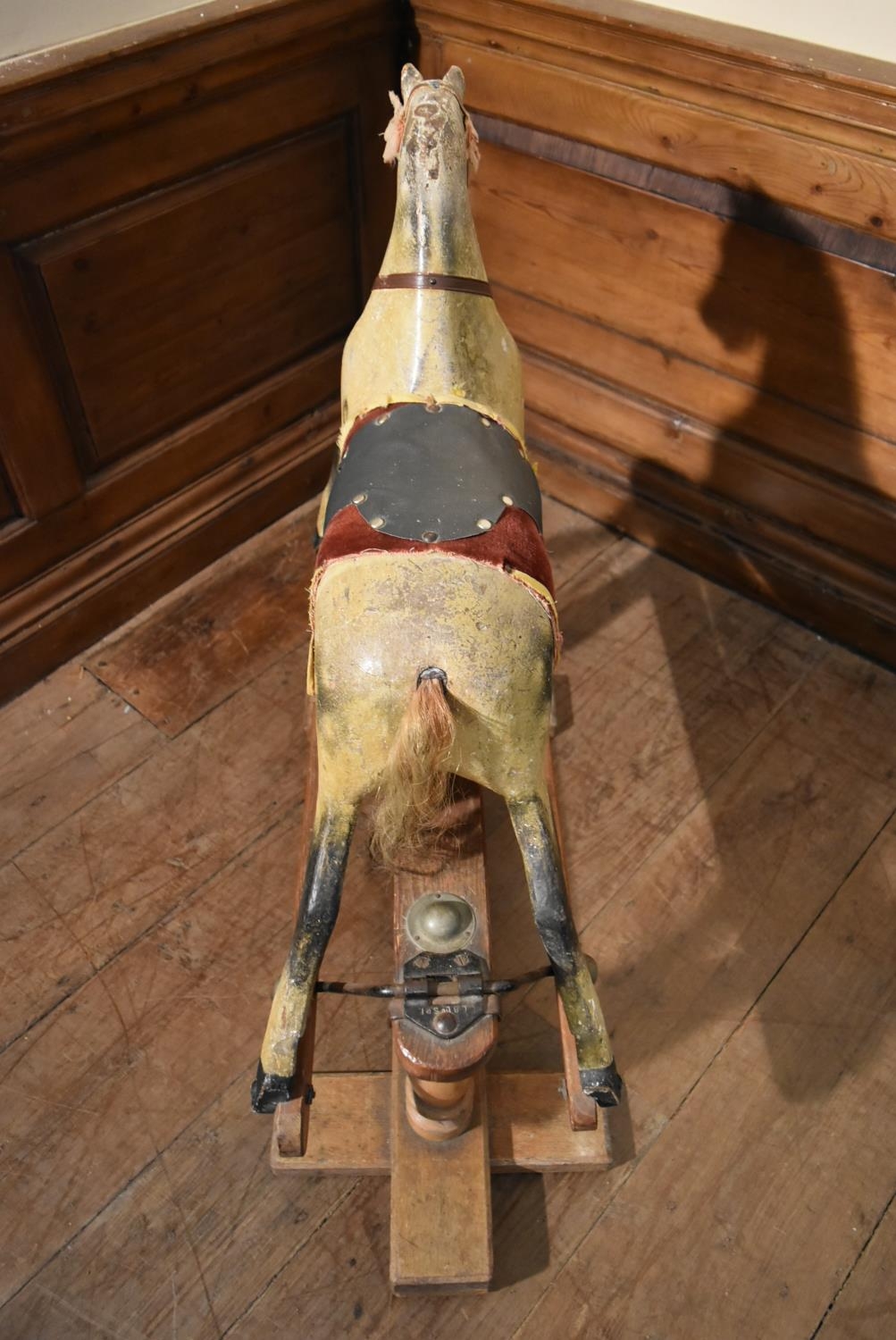 An early 20th century carved and painted Triang rocking horse on swing action oak platform base. H. - Image 8 of 10