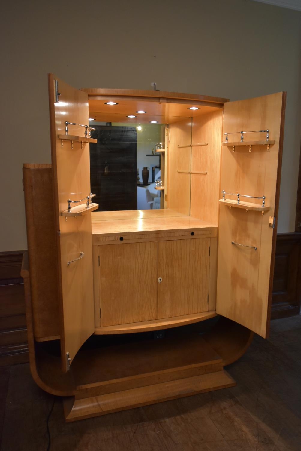 An Art Deco burr walnut cocktail cabinet with ribbed central panel doors enclosing glazed and lit - Image 2 of 23