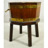 A Georgian mahogany and brass bound wine cooler with twin carrying handles and lift out zinc liner