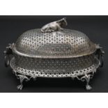 A late 19th century silver plated pierced and lidded butter dish with glass liner and cow shaped