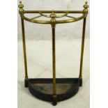 A brass and iron four section umbrella stand of demi lune outline. H.61cm