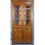 A 19th century style pitch pine two section dresser with glazed upper section above drawers and