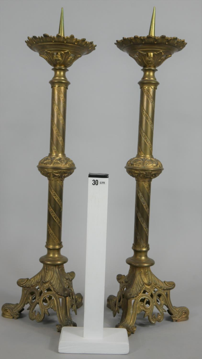 A pair of brass Ecclesiastic style pricket candlesticks on pierced and scrolling tripod bases. H. - Image 5 of 5