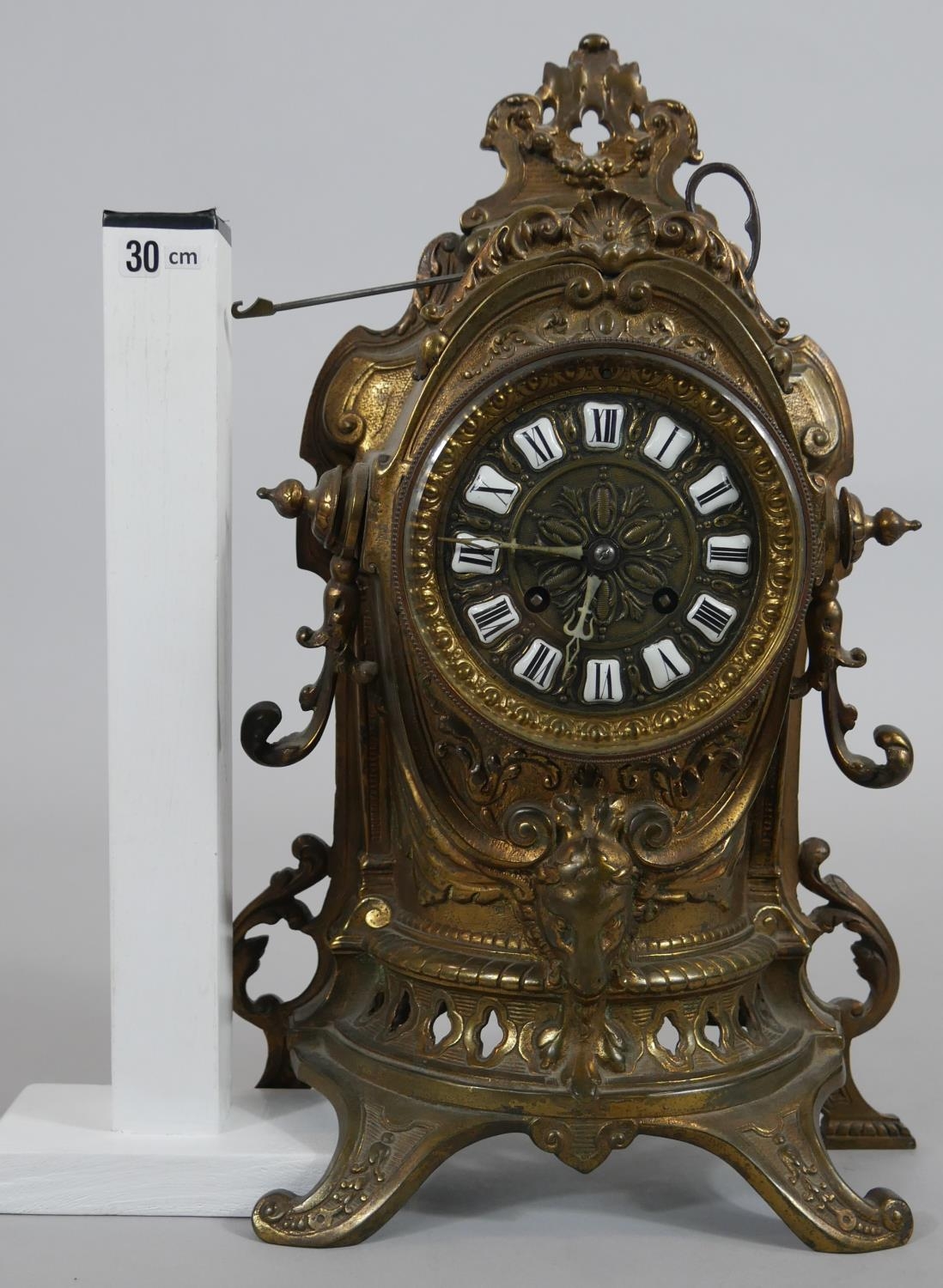A French style brass mantel clock in scrolling Rococo case with enamel Roman numerals and eight - Image 7 of 7