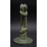 A vintage cast bronze abstract fertility sculpture with circular base. H.20cm