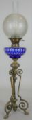 A Victorian oil lamp with cut blue to clear Bohemian glass well and Hinks's No. 2 Duplex burner on