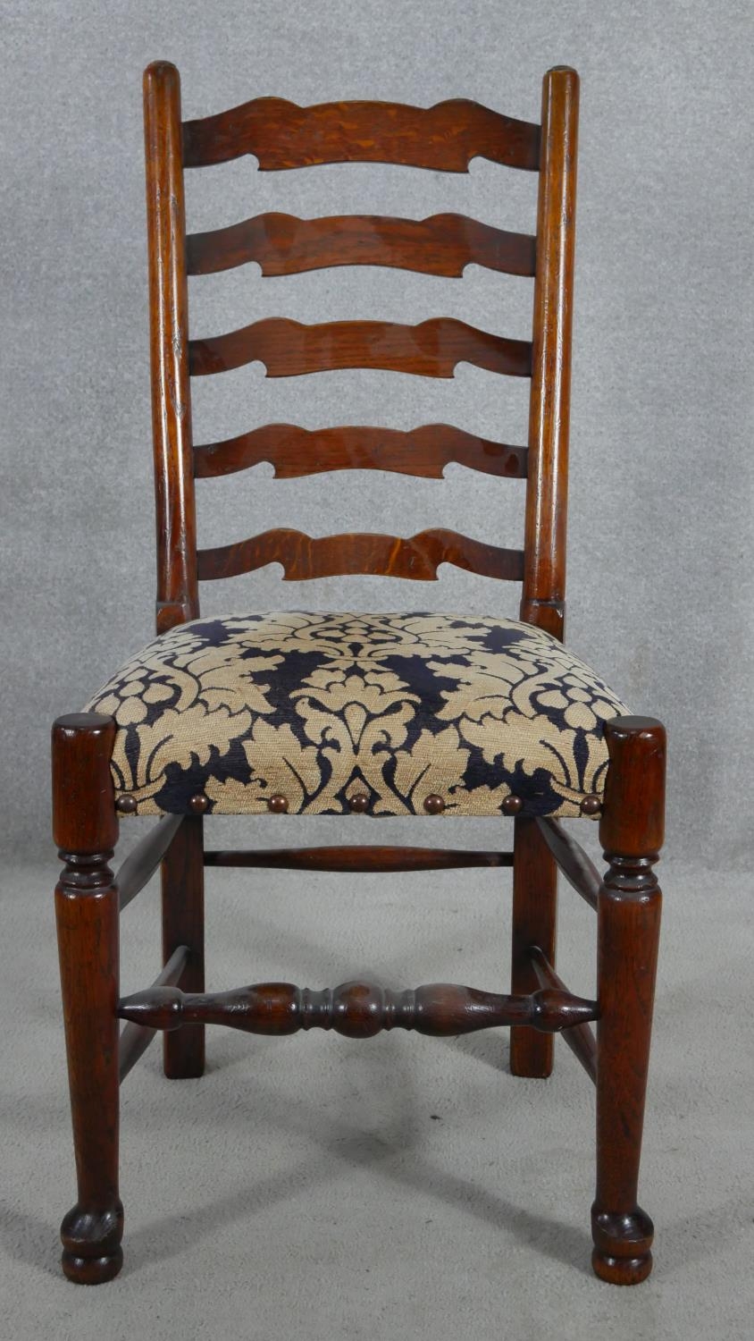 A set of eight oak Lancashire ladderback dining chairs in floral upholstery on turned stretchered - Image 5 of 9
