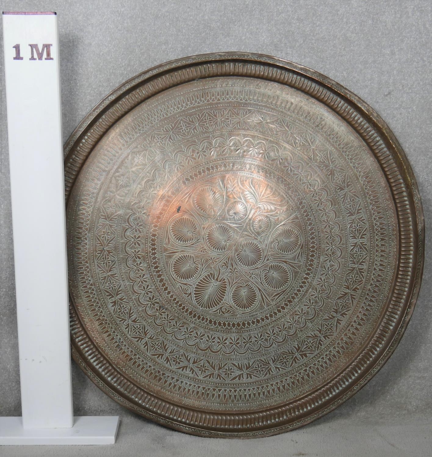 A large brass Eastern engraved tray or table top. D.95cm - Image 3 of 3