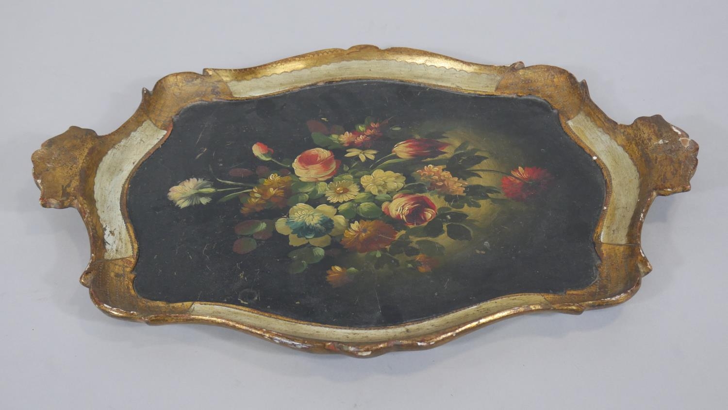 An Italian carved and gilt twin handled tray with hand decorated floral decoration along with two - Image 3 of 4