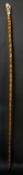 A Victorian ivory carved handled bamboo cane with 18 carat gold collar. Handle carved as a