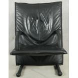 An Arflex T line leather upholstered armchair. H.100cm