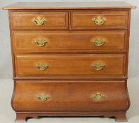 A late 19th century walnut Continental bombe style chest of drawers on shaped bracket feet. H.102