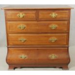 A late 19th century walnut Continental bombe style chest of drawers on shaped bracket feet. H.102