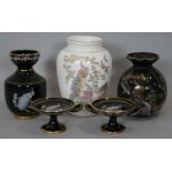 A collection of Greek ceramic pieces with 24 carat gold detailing, decorated with peacocks. Makers