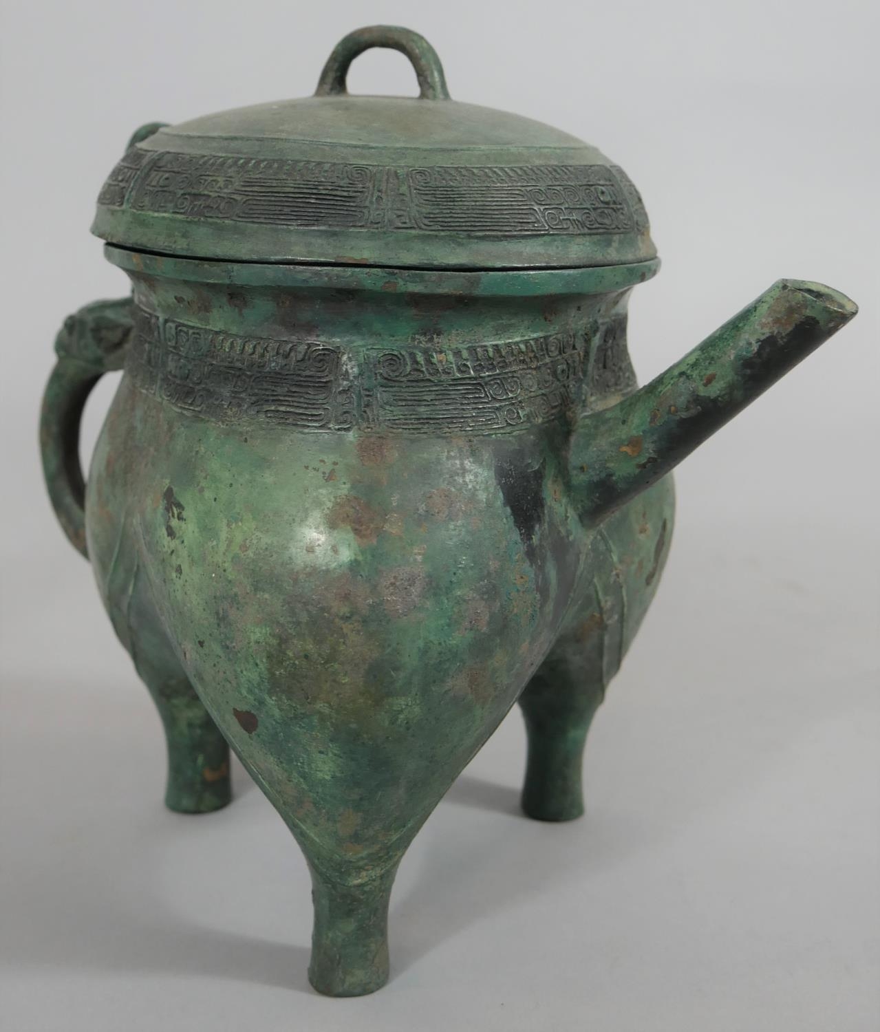 A Chinese bronze archaistic ritual pouring vessel, with character mark to the base. H.23cm