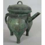 A Chinese bronze archaistic ritual pouring vessel, with character mark to the base. H.23cm