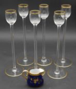 A set of six French gilt crystal tall stemmed liqueur glasses along with an M. Redon Limoges